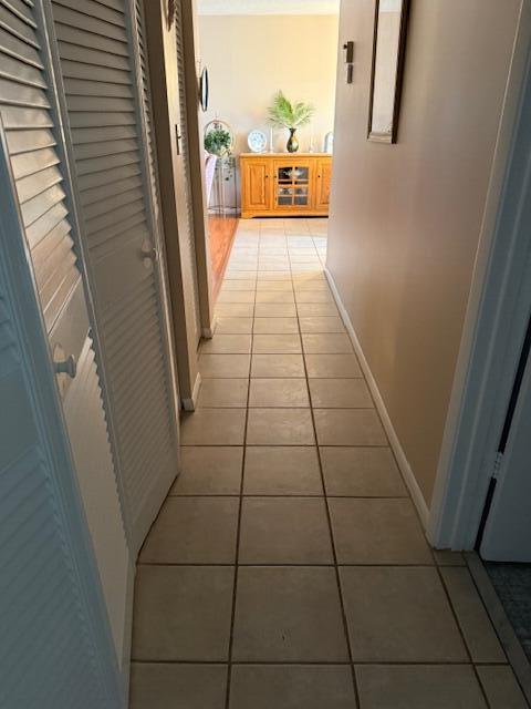 725 Lori Dr Unit 313, Palm Springs, FL 33461 - corridor with light tile patterned floors and baseboards