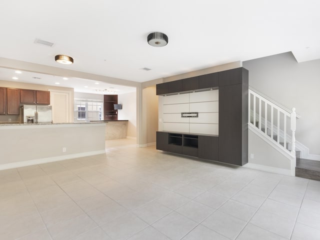 110 W Coda Cir Unit 110, Delray Beach, FL 33444 - unfurnished living room featuring light tile patterned floors, stairs, baseboards, and recessed lighting