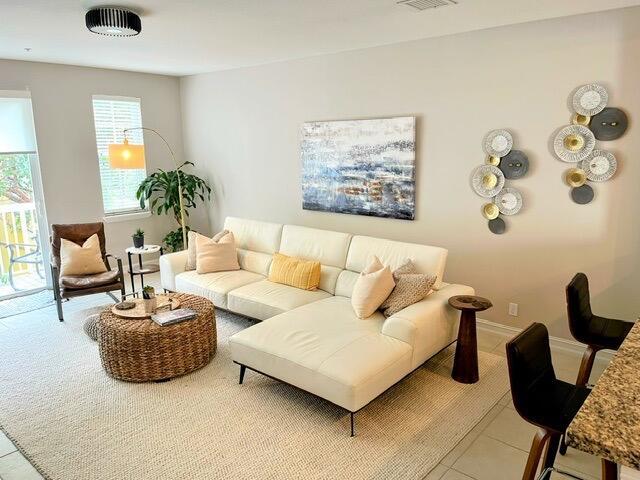 110 W Coda Cir Unit 110, Delray Beach, FL 33444 - living area featuring light tile patterned floors and baseboards