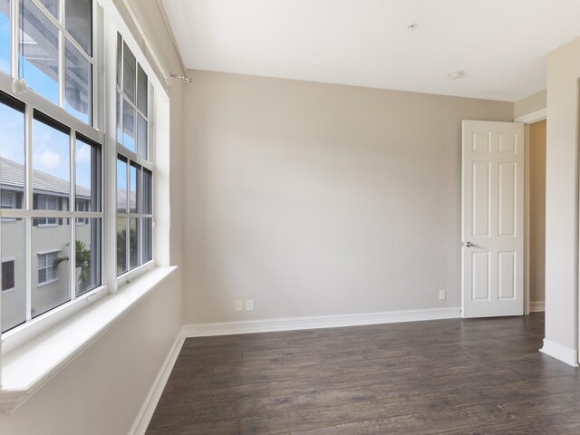 110 W Coda Cir Unit 110, Delray Beach, FL 33444 - spare room featuring baseboards and dark wood-type flooring