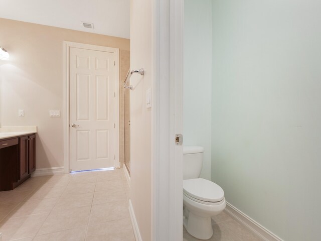 110 W Coda Cir Unit 110, Delray Beach, FL 33444 - bathroom featuring vanity, tile patterned floors, toilet, baseboards, and a shower