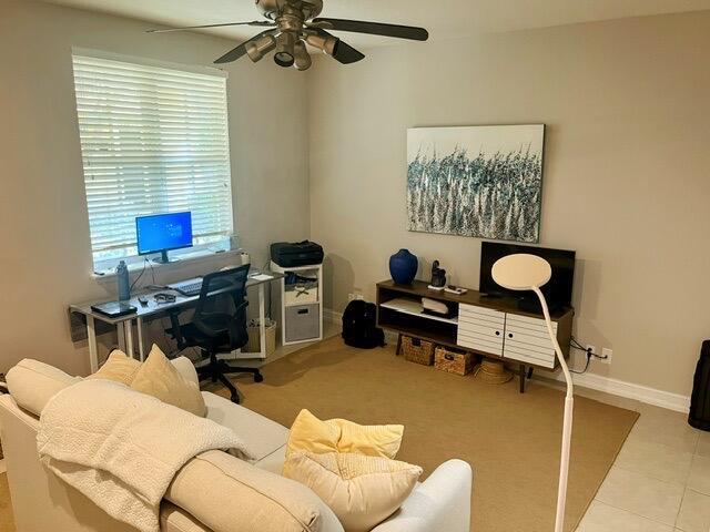 110 W Coda Cir Unit 110, Delray Beach, FL 33444 - tiled home office with healthy amount of natural light, ceiling fan, and baseboards