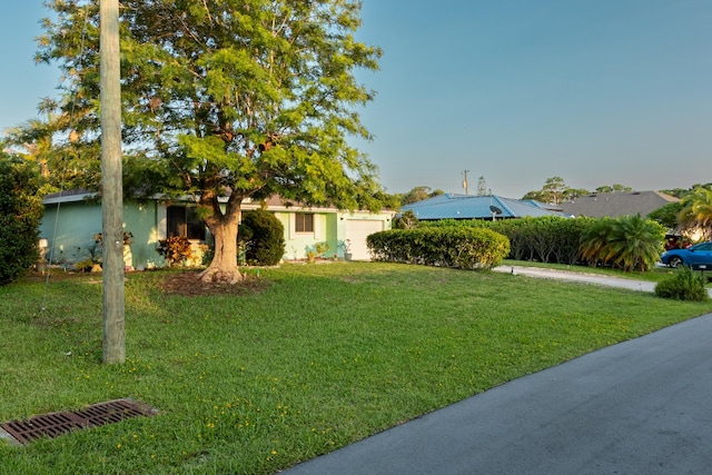 2511 SE Marius St, Port Saint Lucie, FL 34953 - view of front of house featuring a front yard