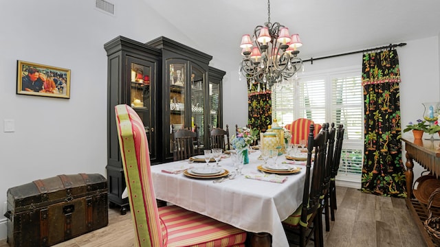 6000 Eagles Nest Dr, Jupiter, FL 33458 - dining room with a chandelier and wood finished floors