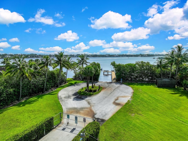 6000 Eagles Nest Dr, Jupiter, FL 33458 - view of yard with a water view, a gate, and a boat dock