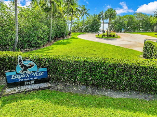 6000 Eagles Nest Dr, Jupiter, FL 33458 - surrounding community with a lawn