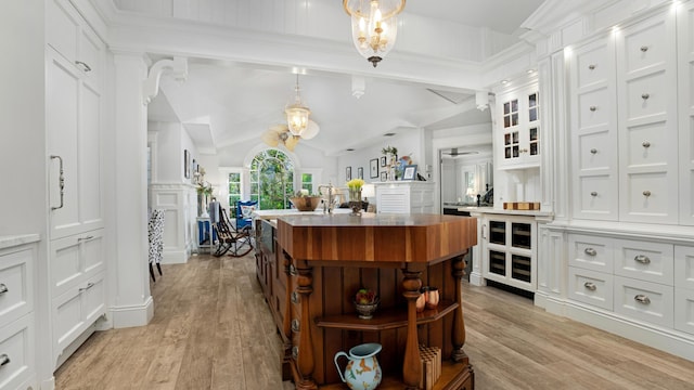 6000 Eagles Nest Dr, Jupiter, FL 33458 - bar with light wood-style flooring, pendant lighting, ceiling fan, and wine cooler