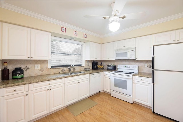 4600 Wildwood Tree A Ln Unit A, Boynton Beach, FL 33436 - kitchen featuring white appliances, a sink, crown molding, white cabinetry, and light wood-style floors