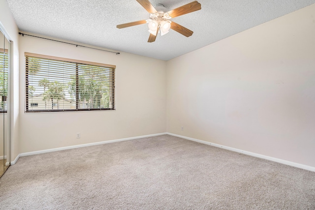 521 Shady Pine Way Unit C2, Greenacres, FL 33415 - carpeted spare room with a textured ceiling, baseboards, and ceiling fan