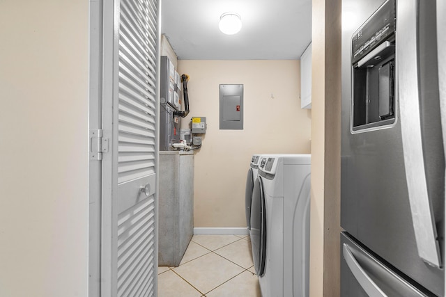 521 Shady Pine Way Unit C2, Greenacres, FL 33415 - laundry room with electric panel, light tile patterned flooring, washing machine and dryer, and baseboards