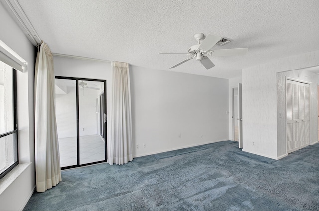 3946 Quail Ridge Dr N, Boynton Beach, FL 33436 - empty room featuring carpet, a ceiling fan, and a textured ceiling