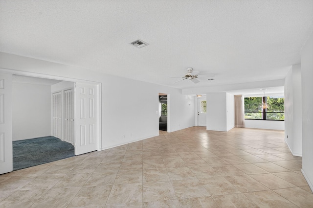3946 Quail Ridge Dr N, Boynton Beach, FL 33436 - unfurnished room with ceiling fan, light tile patterned floors, and a textured ceiling