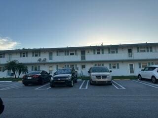 1117 Lake Ter Unit 102, Boynton Beach, FL 33426 - view of building exterior with uncovered parking