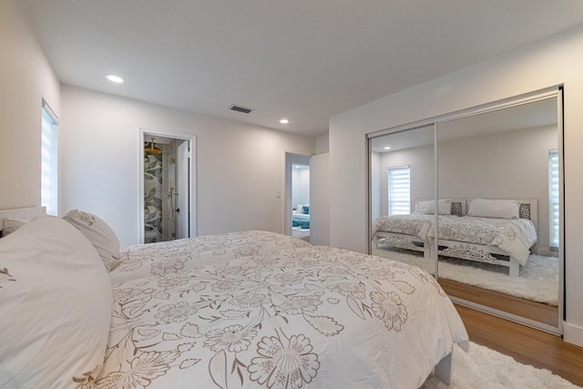 18085 102nd Way S, Boca Raton, FL 33498 - bedroom featuring wood finished floors, a closet, multiple windows, and recessed lighting