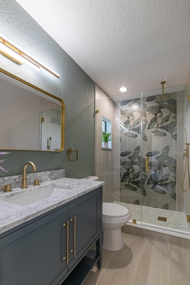 18085 102nd Way S, Boca Raton, FL 33498 - bathroom with a textured ceiling, vanity, a shower stall, a textured wall, and tile patterned flooring