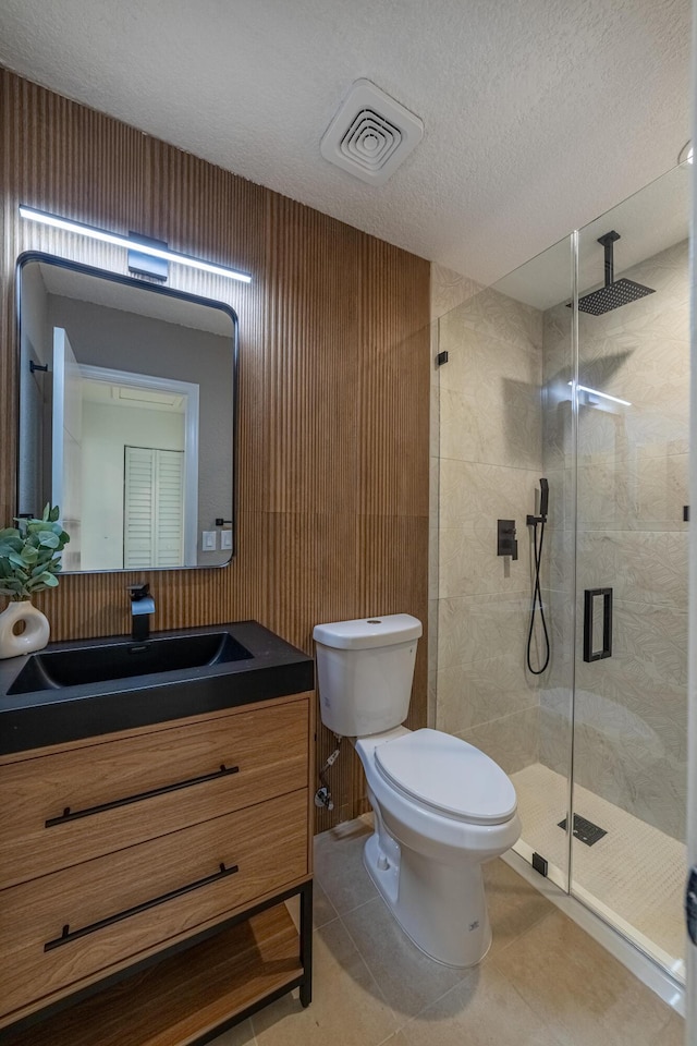 18085 102nd Way S, Boca Raton, FL 33498 - bathroom with a shower stall, vanity, a textured ceiling, and tile patterned flooring