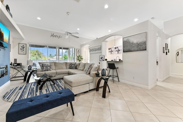 2450 SW Summit St, Port Saint Lucie, FL 34984 - living room featuring arched walkways, a ceiling fan, recessed lighting, light tile patterned floors, and baseboards
