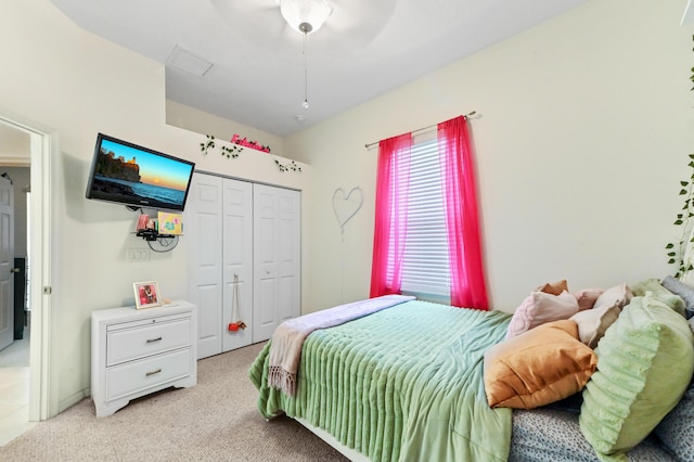 2450 SW Summit St, Port Saint Lucie, FL 34984 - bedroom with light carpet, a closet, and a ceiling fan