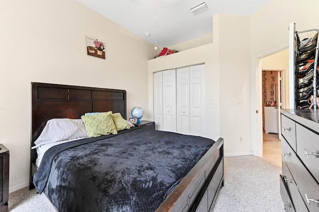 2450 SW Summit St, Port Saint Lucie, FL 34984 - bedroom with a closet, light carpet, and baseboards