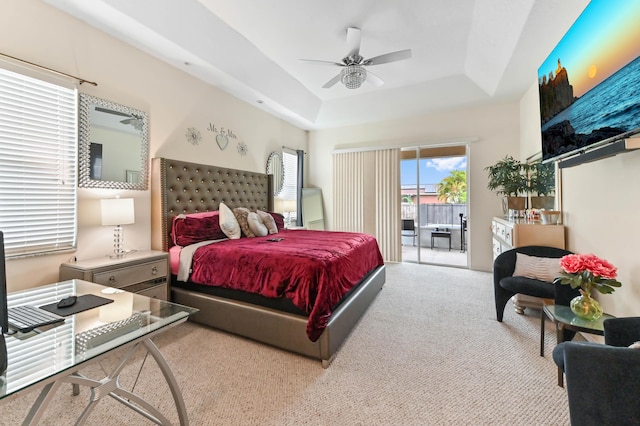 2450 SW Summit St, Port Saint Lucie, FL 34984 - carpeted bedroom featuring access to outside, a raised ceiling, and ceiling fan