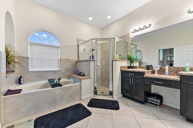 2450 SW Summit St, Port Saint Lucie, FL 34984 - bathroom with vanity, a bath, tile patterned flooring, and a stall shower