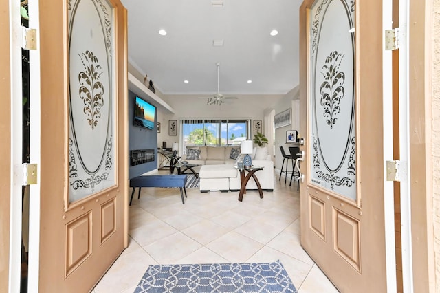 2450 SW Summit St, Port Saint Lucie, FL 34984 - entryway featuring light tile patterned floors, a ceiling fan, recessed lighting, and ornamental molding