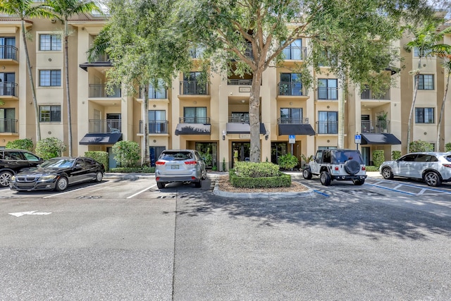 4903 Midtown Ln Unit 3114, Palm Beach Gardens, FL 33418 - view of apartment building / complex featuring uncovered parking