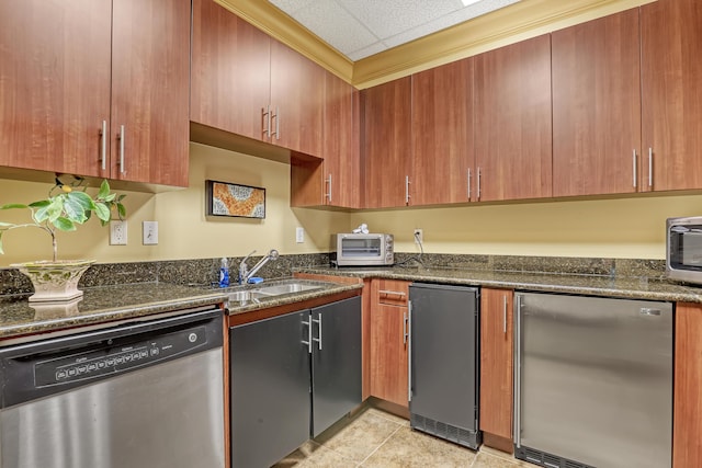 4903 Midtown Ln Unit 3114, Palm Beach Gardens, FL 33418 - kitchen with stainless steel dishwasher, refrigerator, dark stone counters, light tile patterned floors, and a paneled ceiling