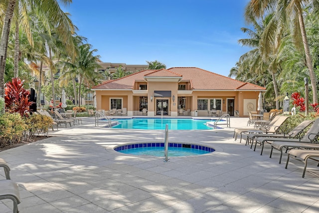 4903 Midtown Ln Unit 3114, Palm Beach Gardens, FL 33418 - community pool with a hot tub, a patio area, and french doors