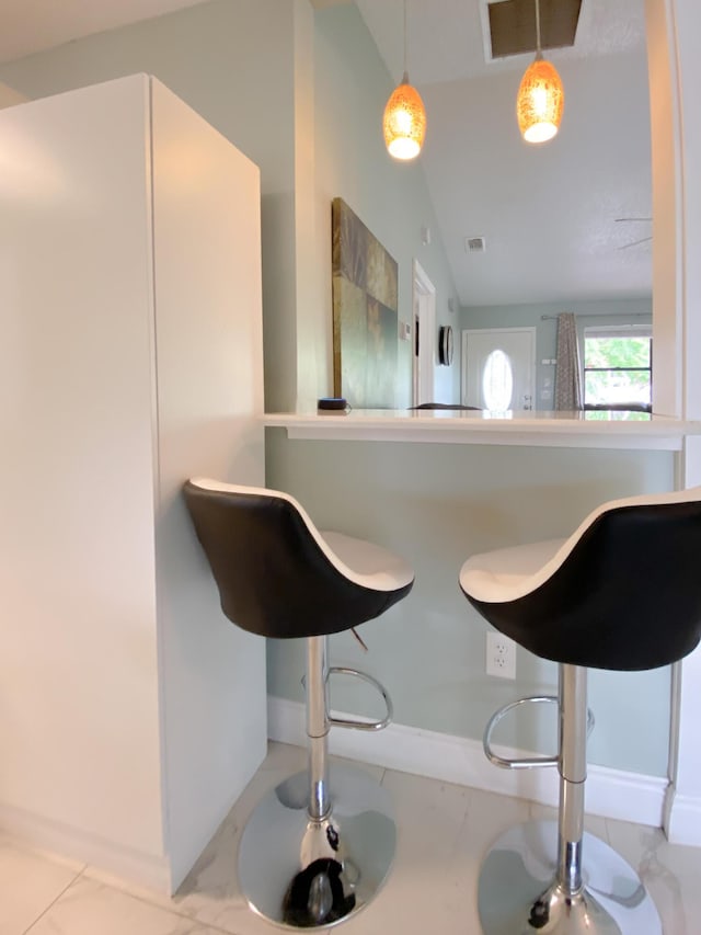 1913 SW Idaho Ln, Port Saint Lucie, FL 34953 - kitchen featuring lofted ceiling and baseboards