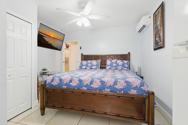 1913 SW Idaho Ln, Port Saint Lucie, FL 34953 - bedroom with a wall unit AC, light tile patterned flooring, ceiling fan, and baseboards