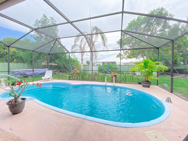 1913 SW Idaho Ln, Port Saint Lucie, FL 34953 - view of pool featuring a fenced backyard, a patio area, and a lanai