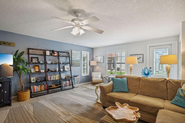 200 S Ocean Blvd Unit B-135, Delray Beach, FL 33483 - living room with plenty of natural light, ceiling fan, a textured ceiling, and tile patterned floors
