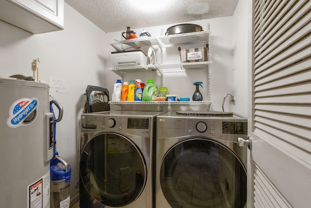 200 S Ocean Blvd Unit B-135, Delray Beach, FL 33483 - laundry room featuring electric water heater, separate washer and dryer, cabinet space, and a textured ceiling