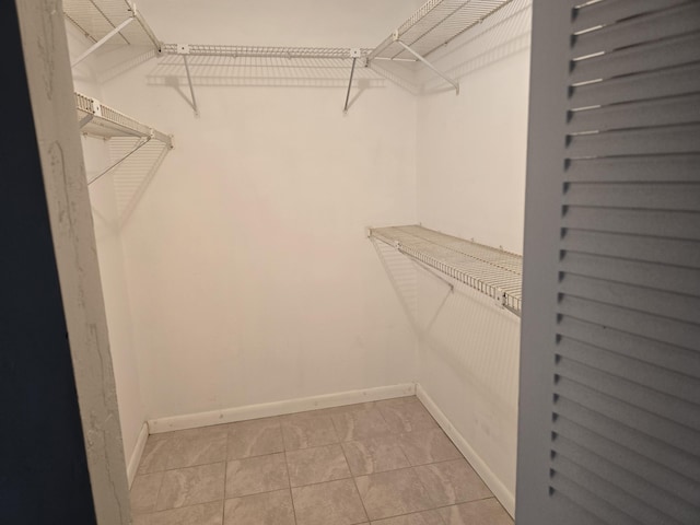 150 Lake Nancy Ln Unit 222, West Palm Beach, FL 33411 - walk in closet featuring light tile patterned floors