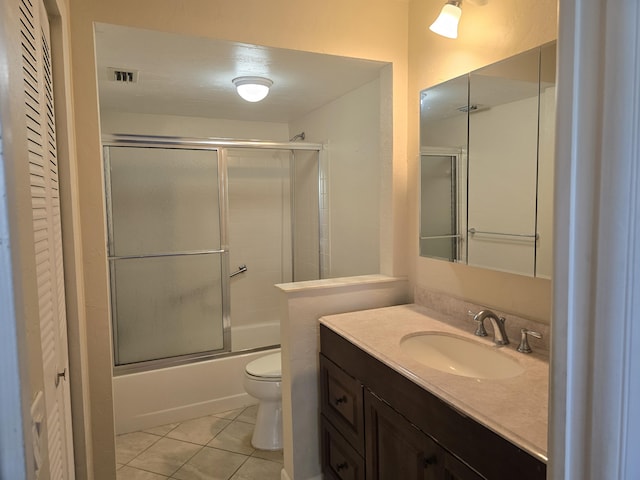150 Lake Nancy Ln Unit 222, West Palm Beach, FL 33411 - bathroom with toilet, vanity, tile patterned floors, and enclosed tub / shower combo
