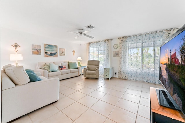 522 Evergreen Dr, Lake Park, FL 33403 - living room with light tile patterned flooring and a ceiling fan