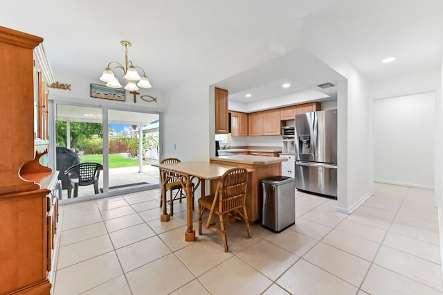 522 Evergreen Dr, Lake Park, FL 33403 - kitchen featuring stainless steel appliances, a chandelier, light countertops, light tile patterned floors, and recessed lighting