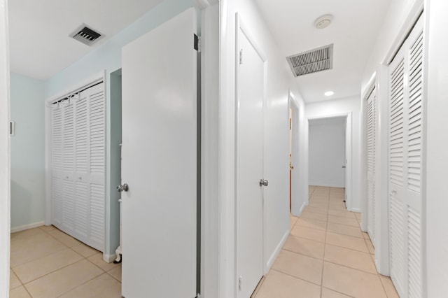 522 Evergreen Dr, Lake Park, FL 33403 - hallway featuring light tile patterned floors, baseboards, and recessed lighting