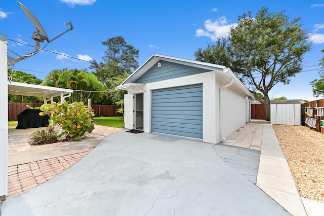 522 Evergreen Dr, Lake Park, FL 33403 - garage featuring concrete driveway