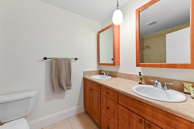 522 Evergreen Dr, Lake Park, FL 33403 - full bathroom with double vanity, baseboards, toilet, and tile patterned floors