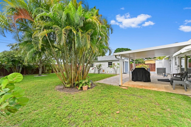 522 Evergreen Dr, Lake Park, FL 33403 - view of yard featuring a patio and cooling unit