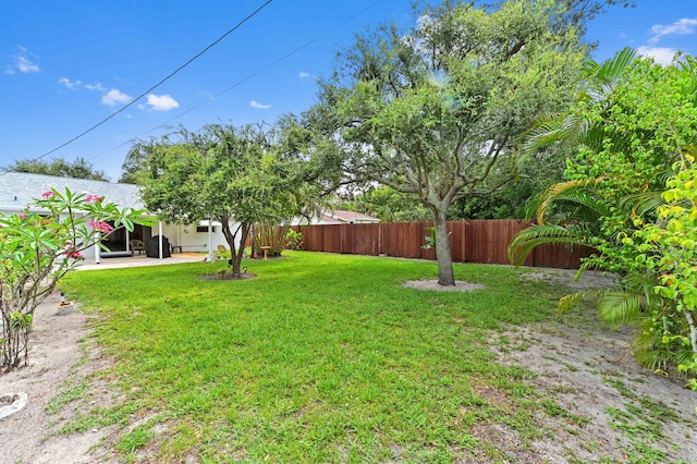 522 Evergreen Dr, Lake Park, FL 33403 - view of yard featuring a patio