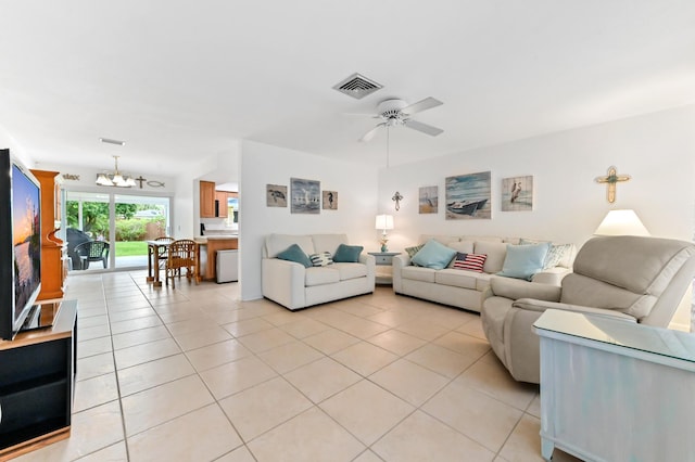 522 Evergreen Dr, Lake Park, FL 33403 - living area featuring a chandelier, light tile patterned floors, and a ceiling fan