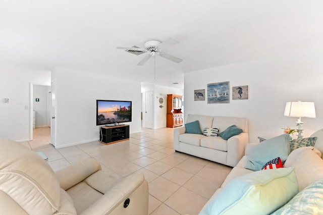 522 Evergreen Dr, Lake Park, FL 33403 - living area with light tile patterned floors, ceiling fan, and baseboards