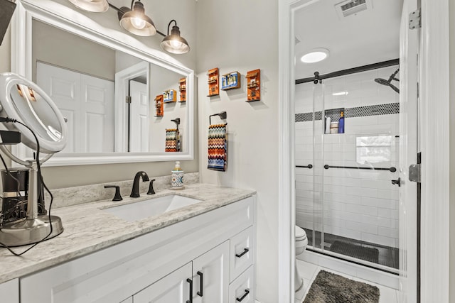 12829 Briarlake Dr Unit 102, Palm Beach Gardens, FL 33418 - bathroom with toilet, vanity, and a shower stall