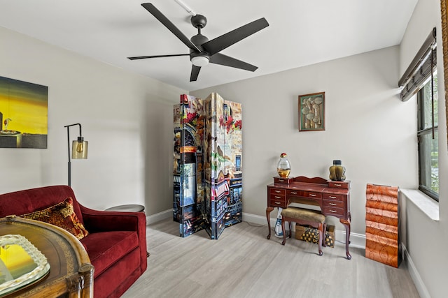 12829 Briarlake Dr Unit 102, Palm Beach Gardens, FL 33418 - living area featuring wood finished floors, ceiling fan, and baseboards