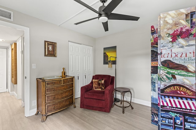 12829 Briarlake Dr Unit 102, Palm Beach Gardens, FL 33418 - sitting room featuring a ceiling fan, wood finished floors, and baseboards