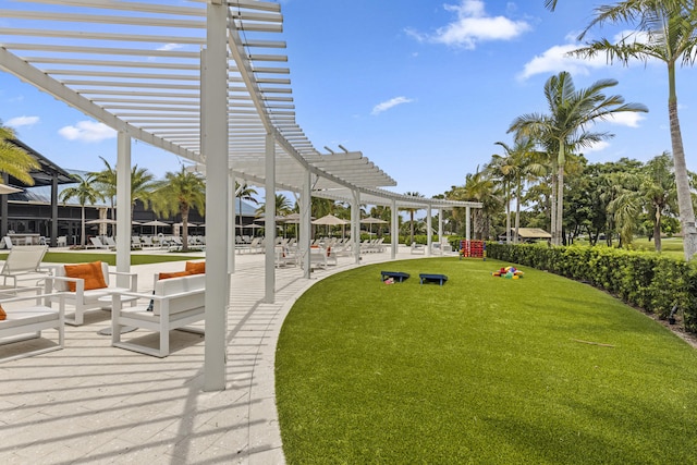 12829 Briarlake Dr Unit 102, Palm Beach Gardens, FL 33418 - view of grassy yard featuring a pergola