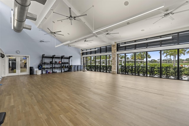12829 Briarlake Dr Unit 102, Palm Beach Gardens, FL 33418 - exercise room with a towering ceiling, a ceiling fan, and wood finished floors